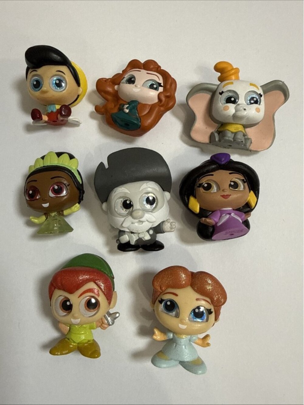 Disney Doorables Lot of 8 - Dumbo - Jasmine - Wendy -Stinky Pete -Peter Pan